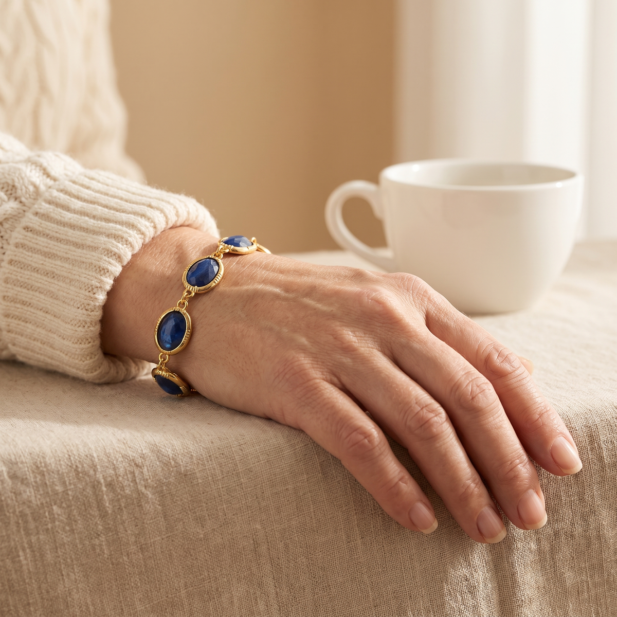 Sapphire-Blue Oval Link Gold Bracelet – worn